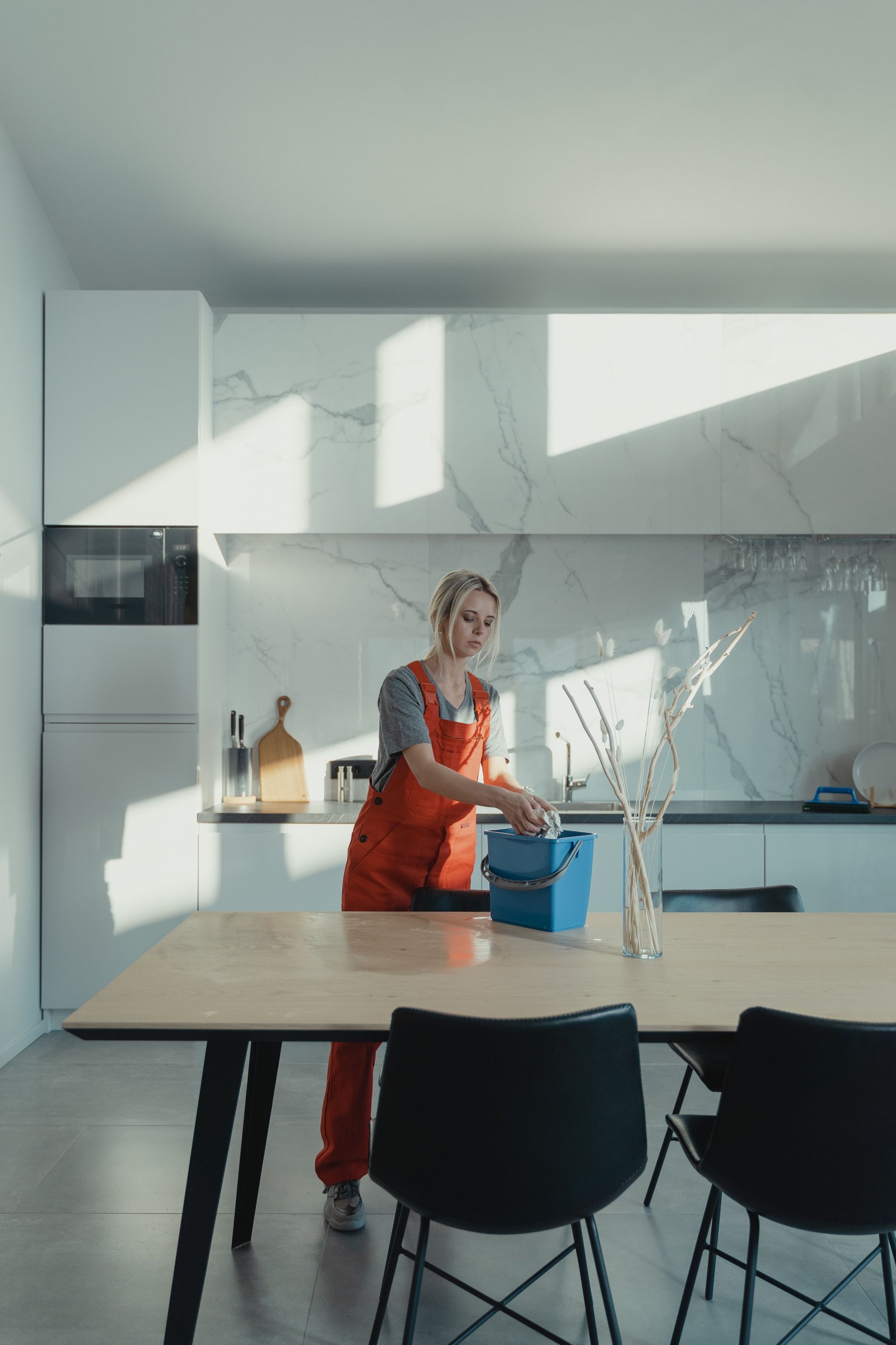 Cleaner wiping down a commercial office kitchen counter