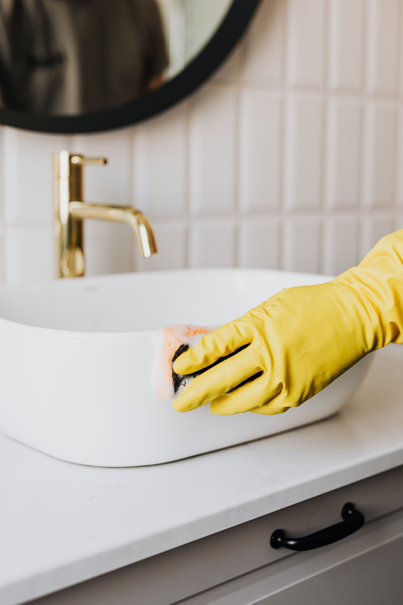 Deep cleaning a bathroom sink and faucet